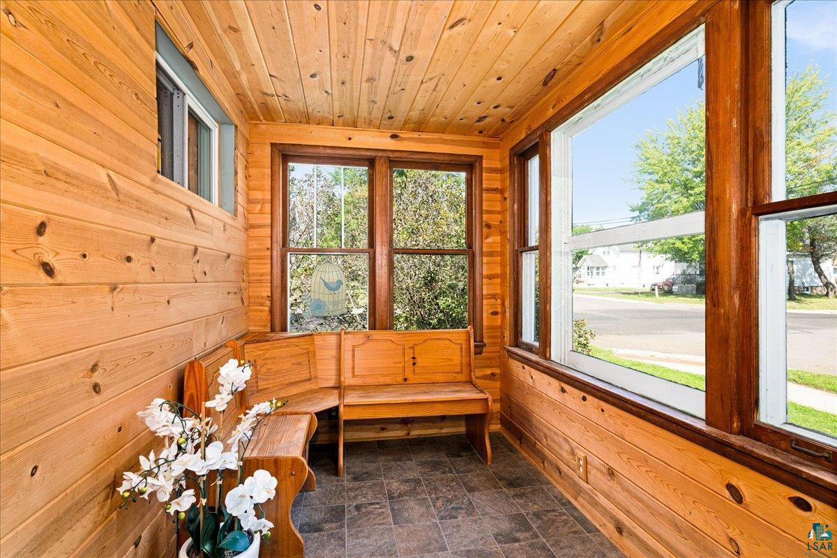 519 3rd Avenue Proctor, MN 55810 - Photo 4 of 25 Unfurnished sunroom with wood ceiling