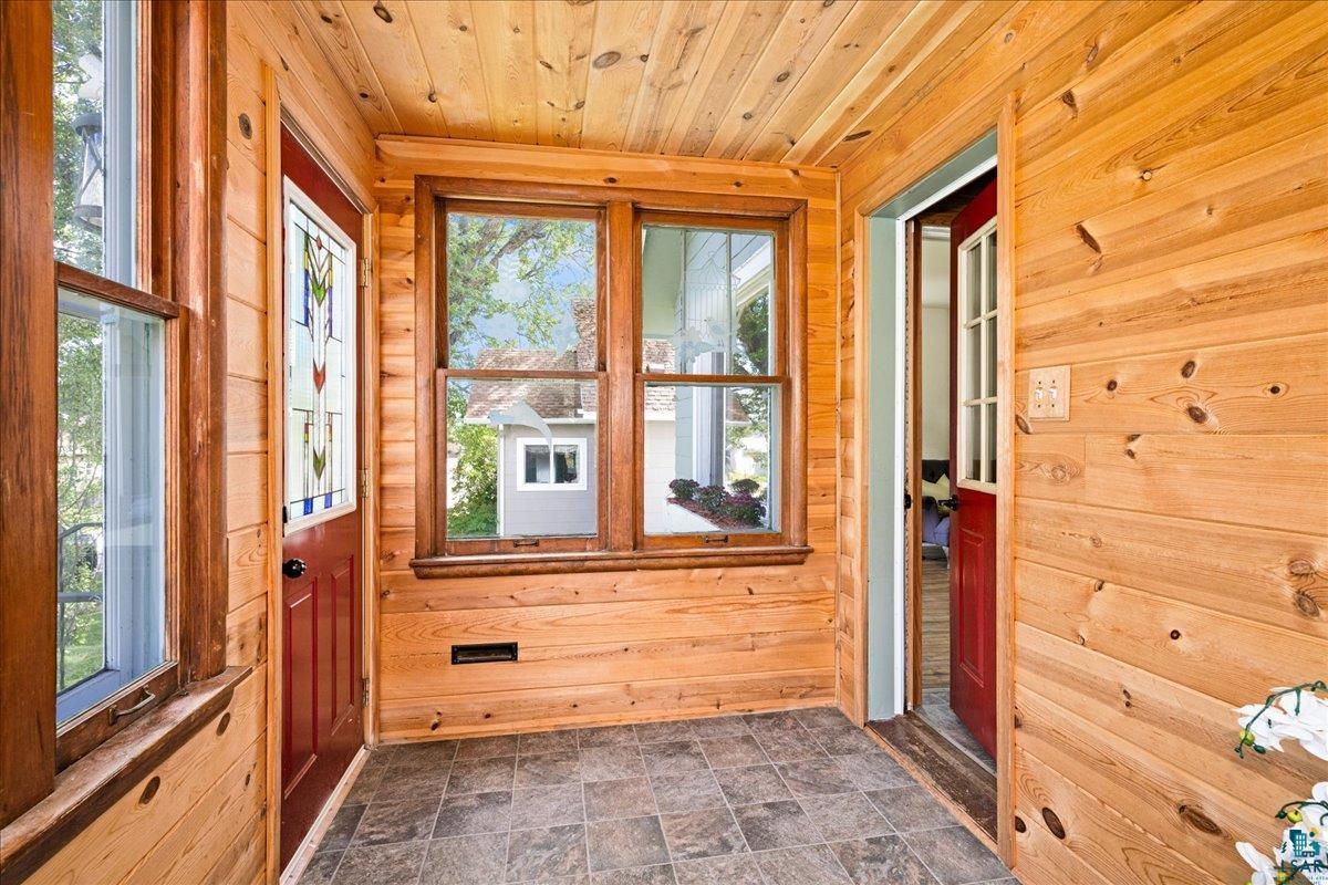 519 3rd Avenue Proctor, MN 55810 - Photo 5 of 25 Doorway with wood walls and wooden ceiling