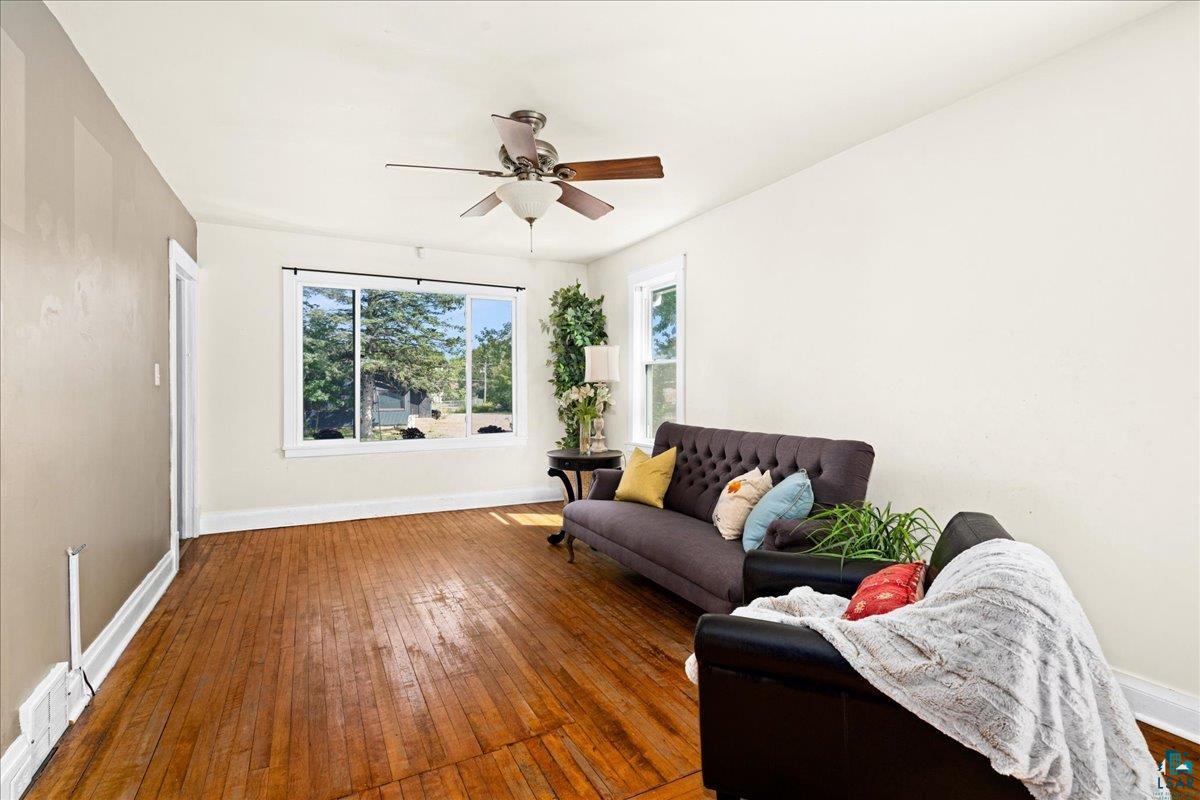 519 3rd Avenue Proctor, MN 55810 - Photo 7 of 25 Living area with ceiling fan and dark hardwood / wood-style floors