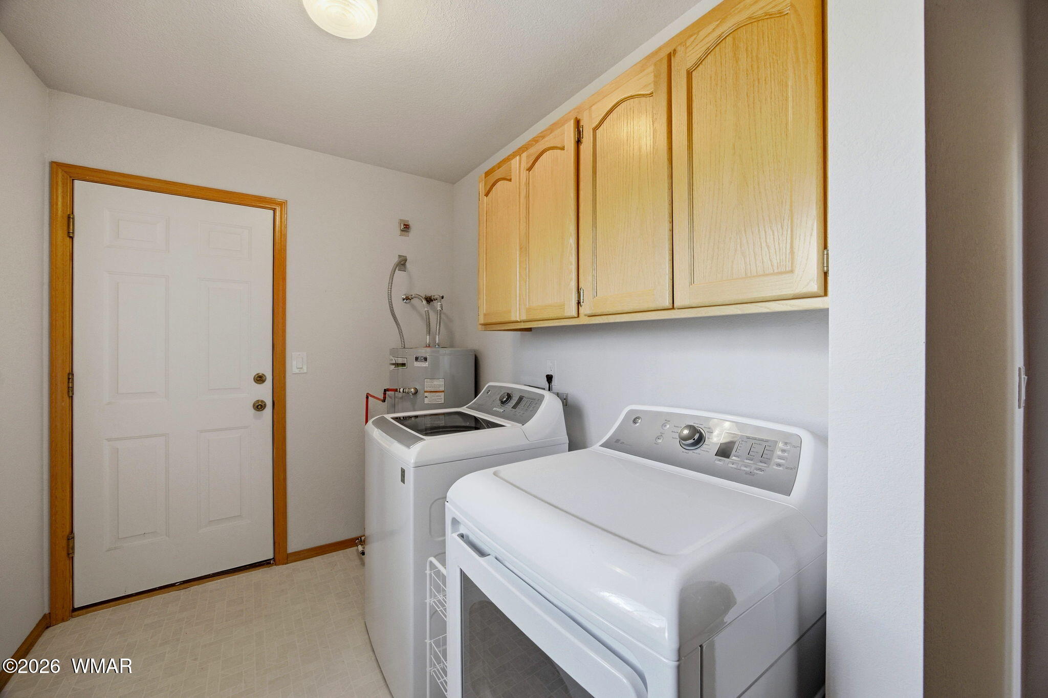 2806 Sky Hawk Drive Overgaard, AZ 85933 - Photo 29 of 43 a utility room with dryer and washer