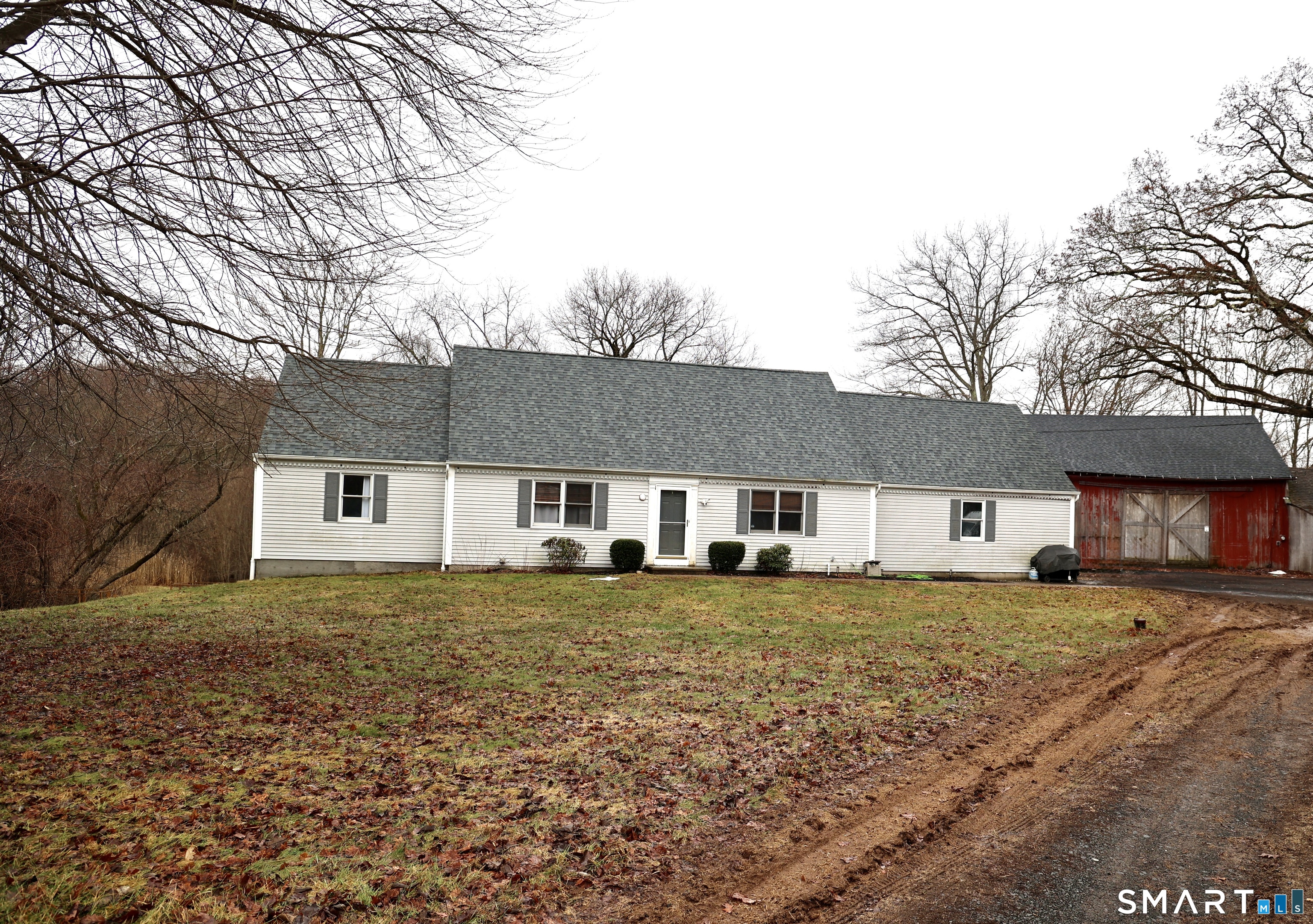 a house that has a tree in front of it