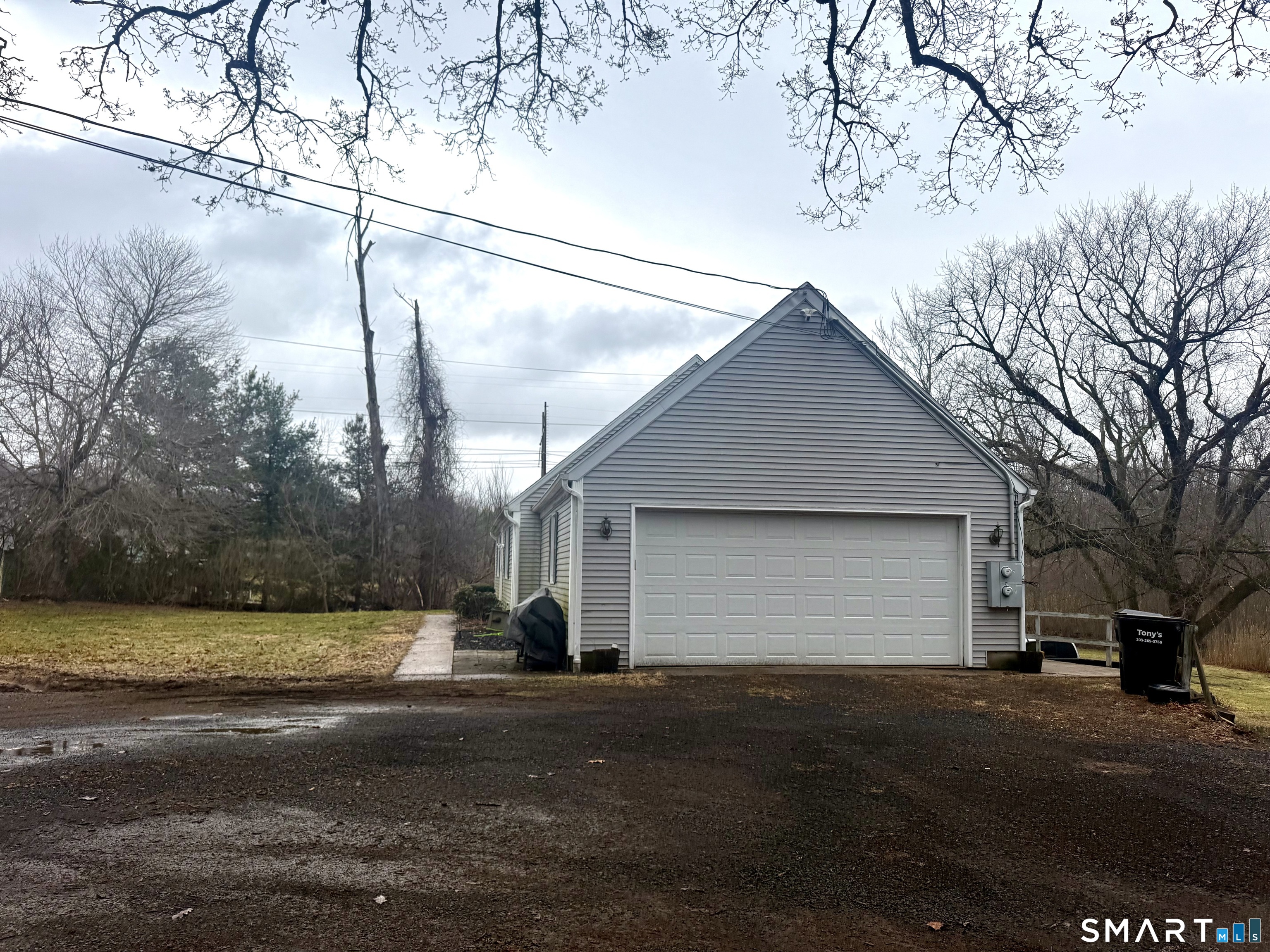 1257 Durham Road Wallingford, CT 06492 - Photo 3 of 19 a view of a house with a yard and garage