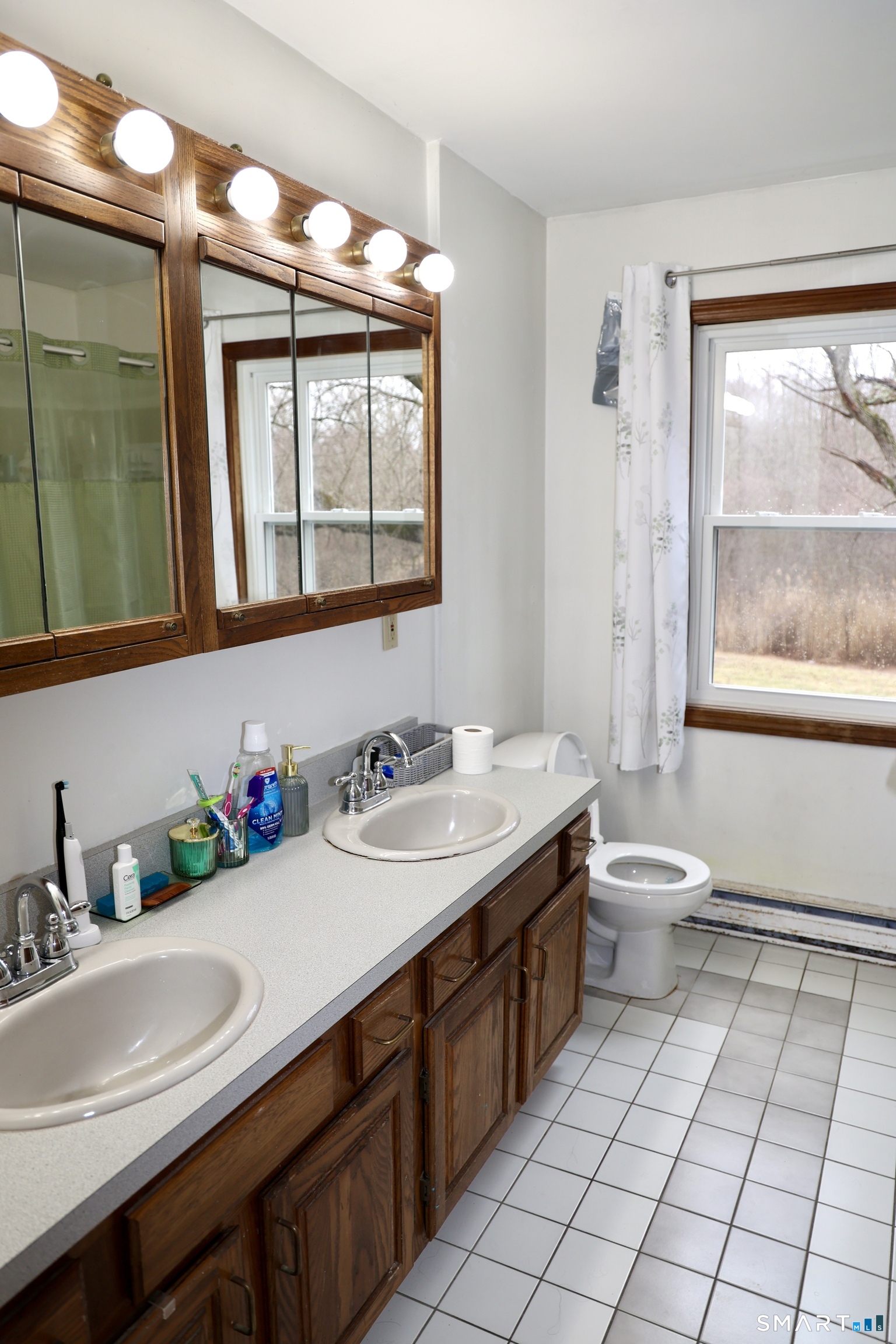 1257 Durham Road Wallingford, CT 06492 - Photo 6 of 19 a bathroom with a granite countertop sink mirror and a toilet