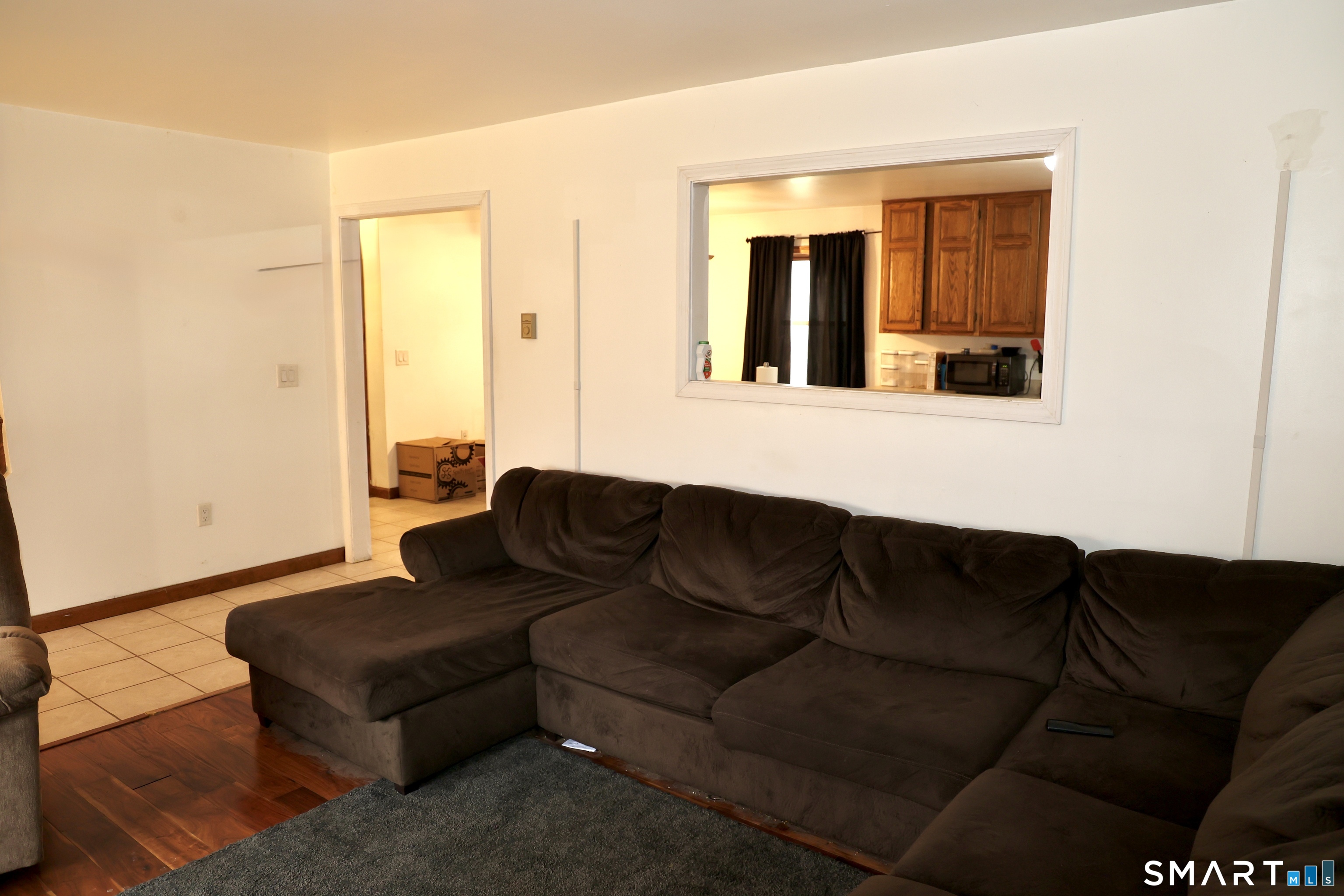 1257 Durham Road Wallingford, CT 06492 - Photo 9 of 19 a living room with furniture and a potted plant