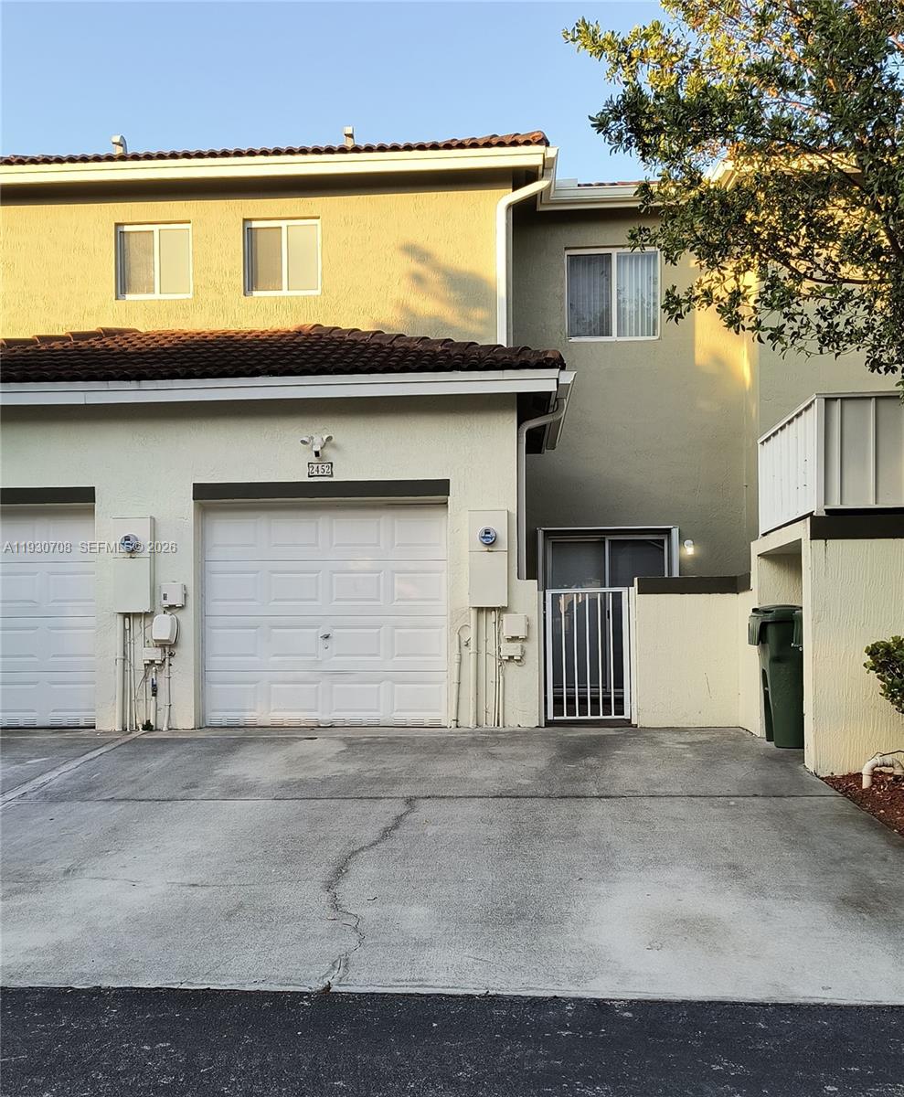 2452 Southeast 19th Court Homestead, FL 33035 - Photo 3 of 10 a view of a house with a garage