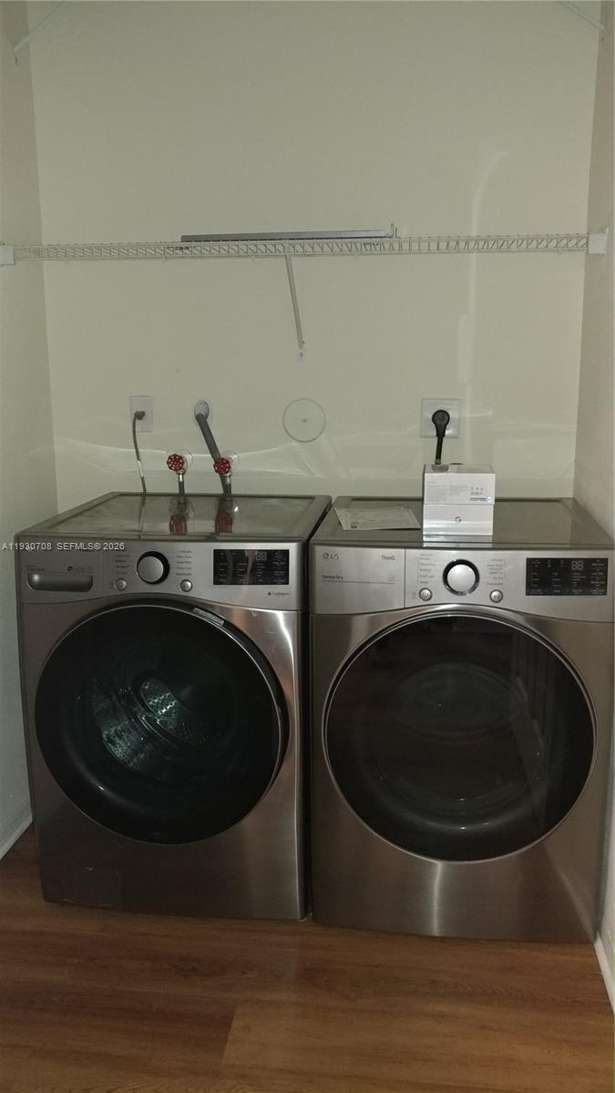 2452 Southeast 19th Court Homestead, FL 33035 - Photo 9 of 10 a utility room with sink dryer and washer