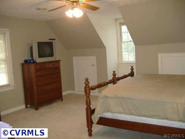 538 Fords Road Manakin-Sabot, VA 23103 - Photo 5 of 10 a bedroom with a bed and a flat tv screen on dresser