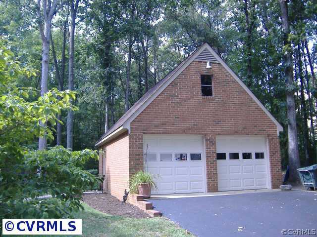 538 Fords Road Manakin-Sabot, VA 23103 - Photo 9 of 10 a front view of a house with a yard and garage