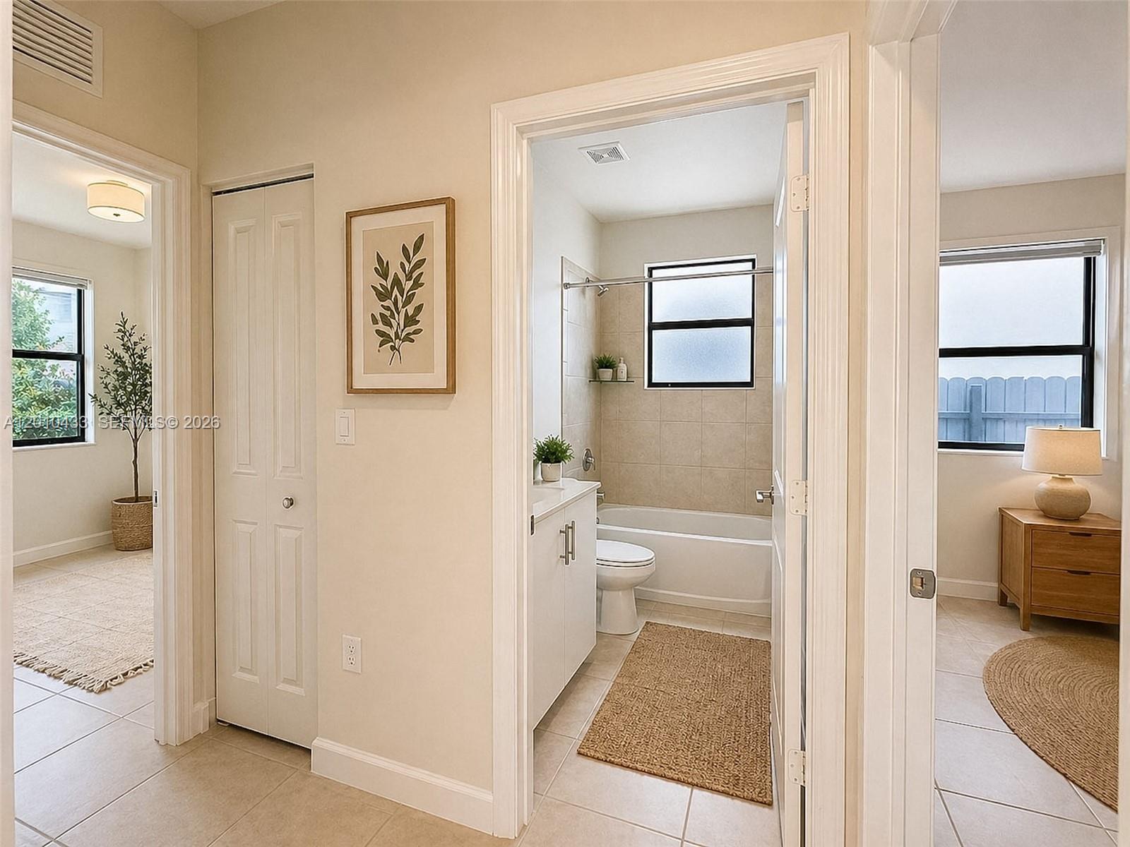 12957 Southwest 229th Street, Unit 12957 Miami, FL 33170 - Photo 11 of 25 When you enter, you see two bedrooms and the bathroom on the left.