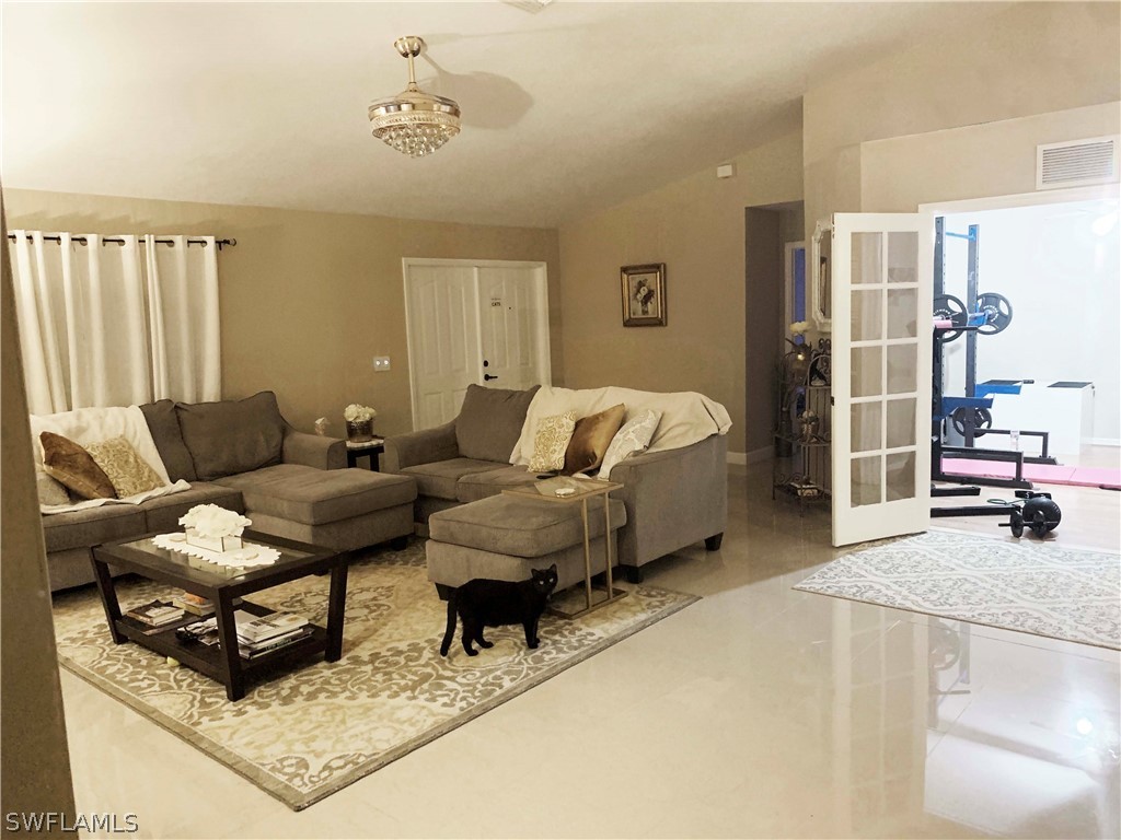 8382 Trillium Road Fort Myers, FL 33967 - Photo 3 of 19 a living room with furniture and a couch