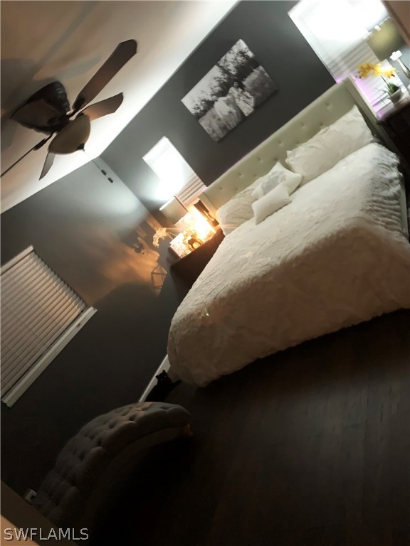 8382 Trillium Road Fort Myers, FL 33967 - Photo 5 of 19 a bed sitting in a room next to a lamp