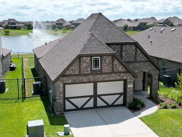 an aerial view of a house having yard
