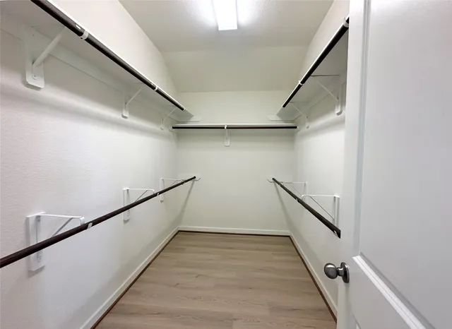 a bathroom with a double vanity sink a and mirror