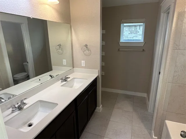 a bathroom with a white bath tub