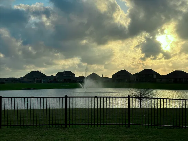 a view of a house with a yard and garage
