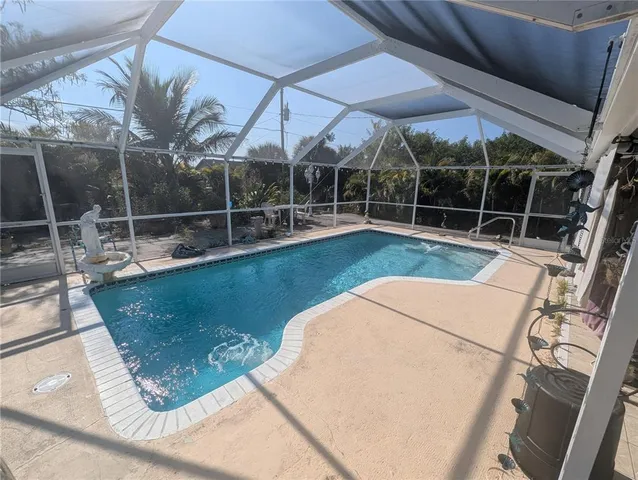a view of a swimming pool with a patio