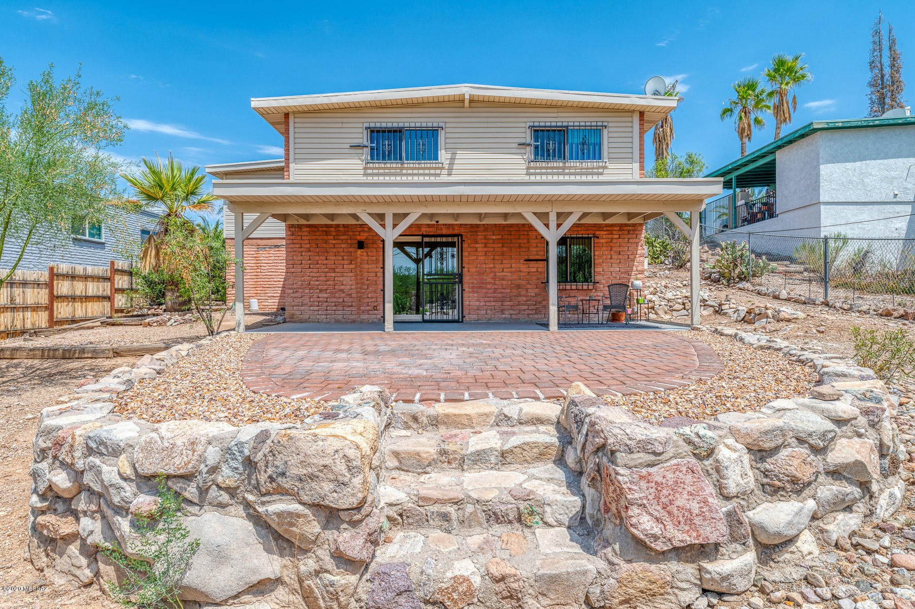 1825 North Old Ranch Road Tucson, AZ 85745 - Photo 28 of 35 a front view of a house with garden