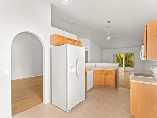 a kitchen with stainless steel appliances a refrigerator and a stove