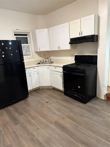 a kitchen with a sink and a stove