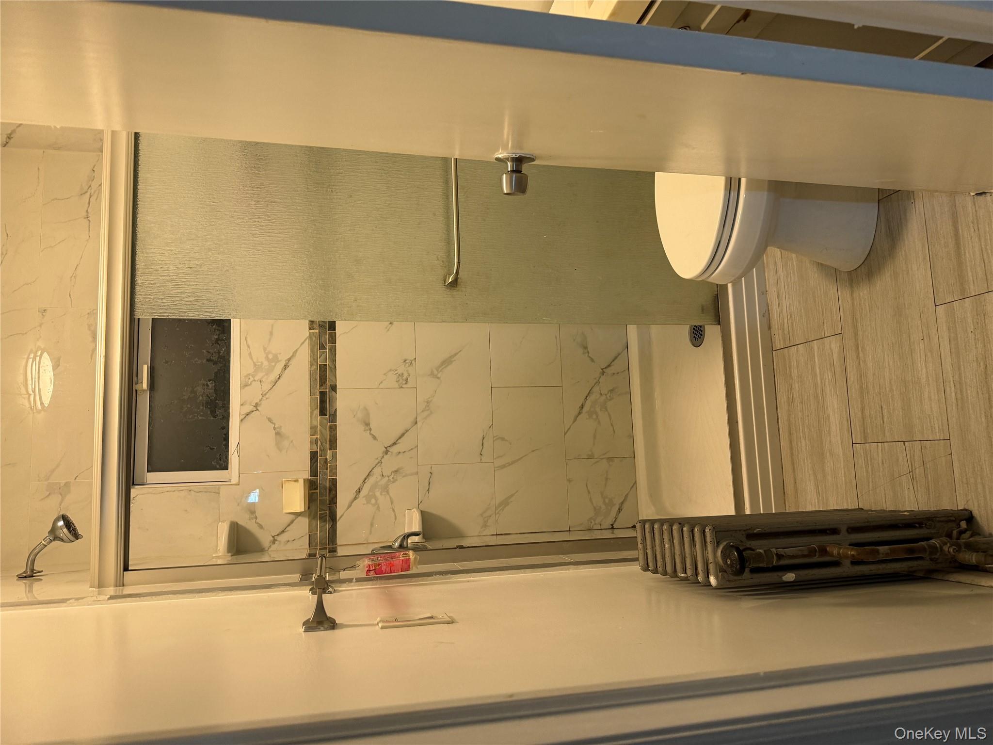 116-13 95th Avenue Queens, NY 11419 - Photo 4 of 7 a bathroom with a shower and a toilet