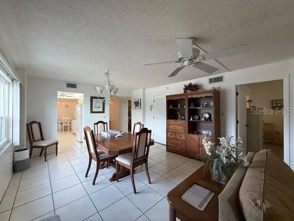 a view of a dining room with furniture and window
