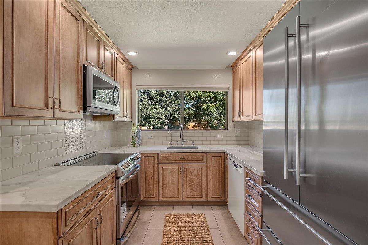 12296 Atrium Circle Saratoga, CA 95070 - Photo 13 of 34 a kitchen with a sink stove and refrigerator