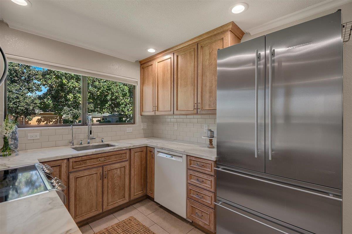 12296 Atrium Circle Saratoga, CA 95070 - Photo 14 of 34 a kitchen with a sink and refrigerator