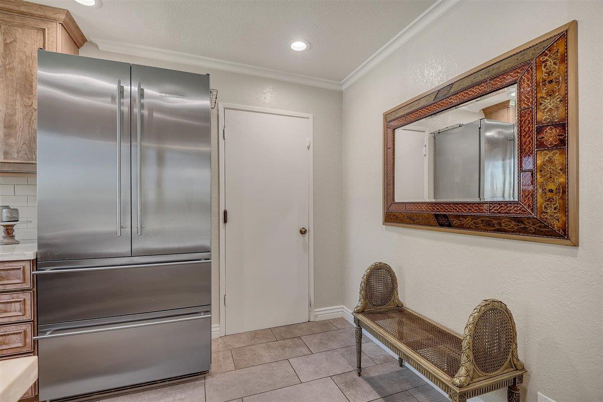 12296 Atrium Circle Saratoga, CA 95070 - Photo 16 of 34 a room with a refrigerator and chair