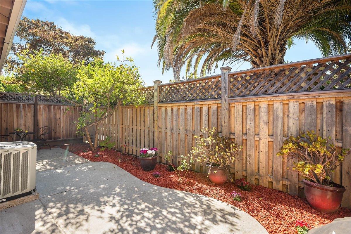 12296 Atrium Circle Saratoga, CA 95070 - Photo 26 of 34 a backyard of a house with table and chairs