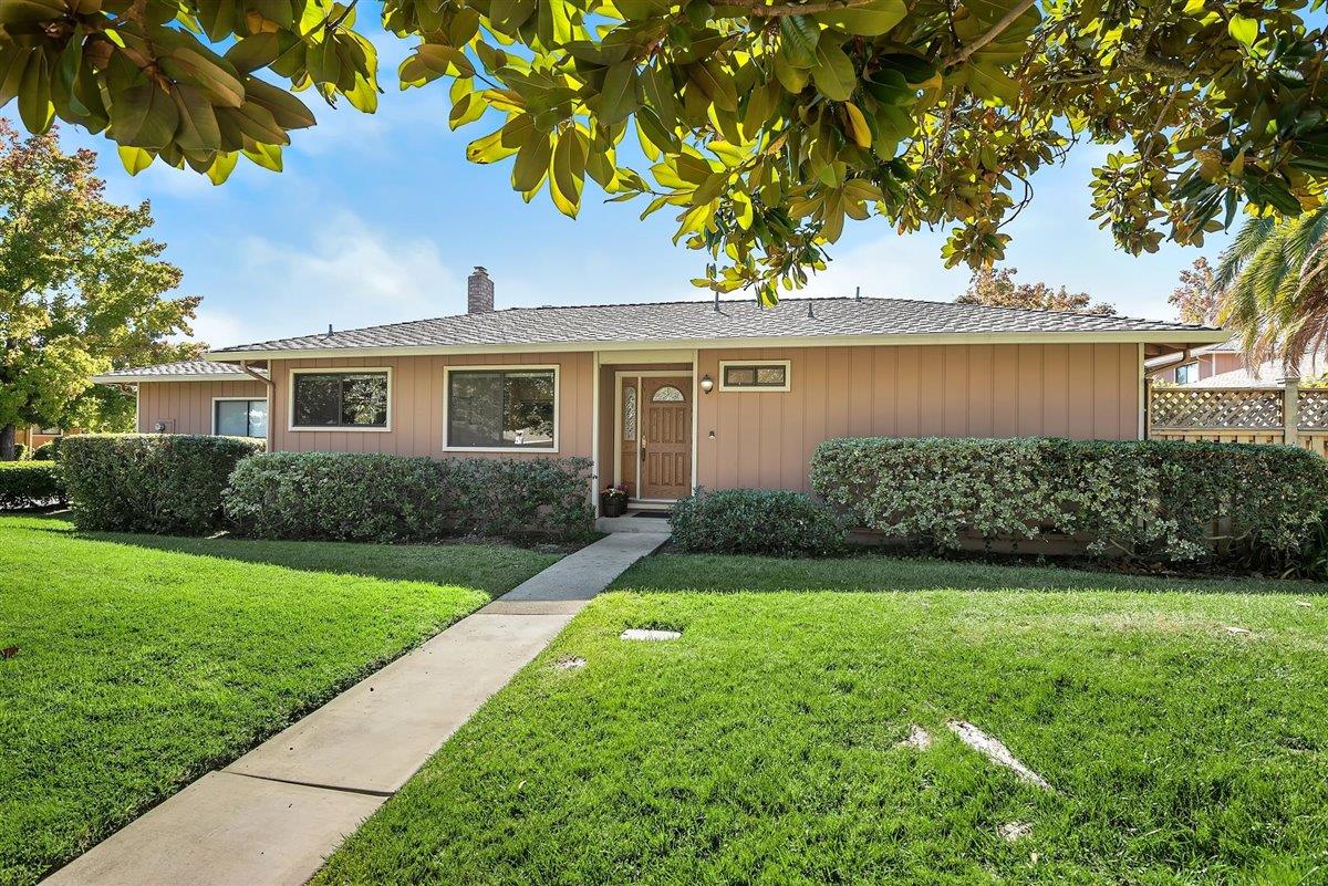 12296 Atrium Circle Saratoga, CA 95070 - Photo 29 of 34 a front view of a house with a yard and garage