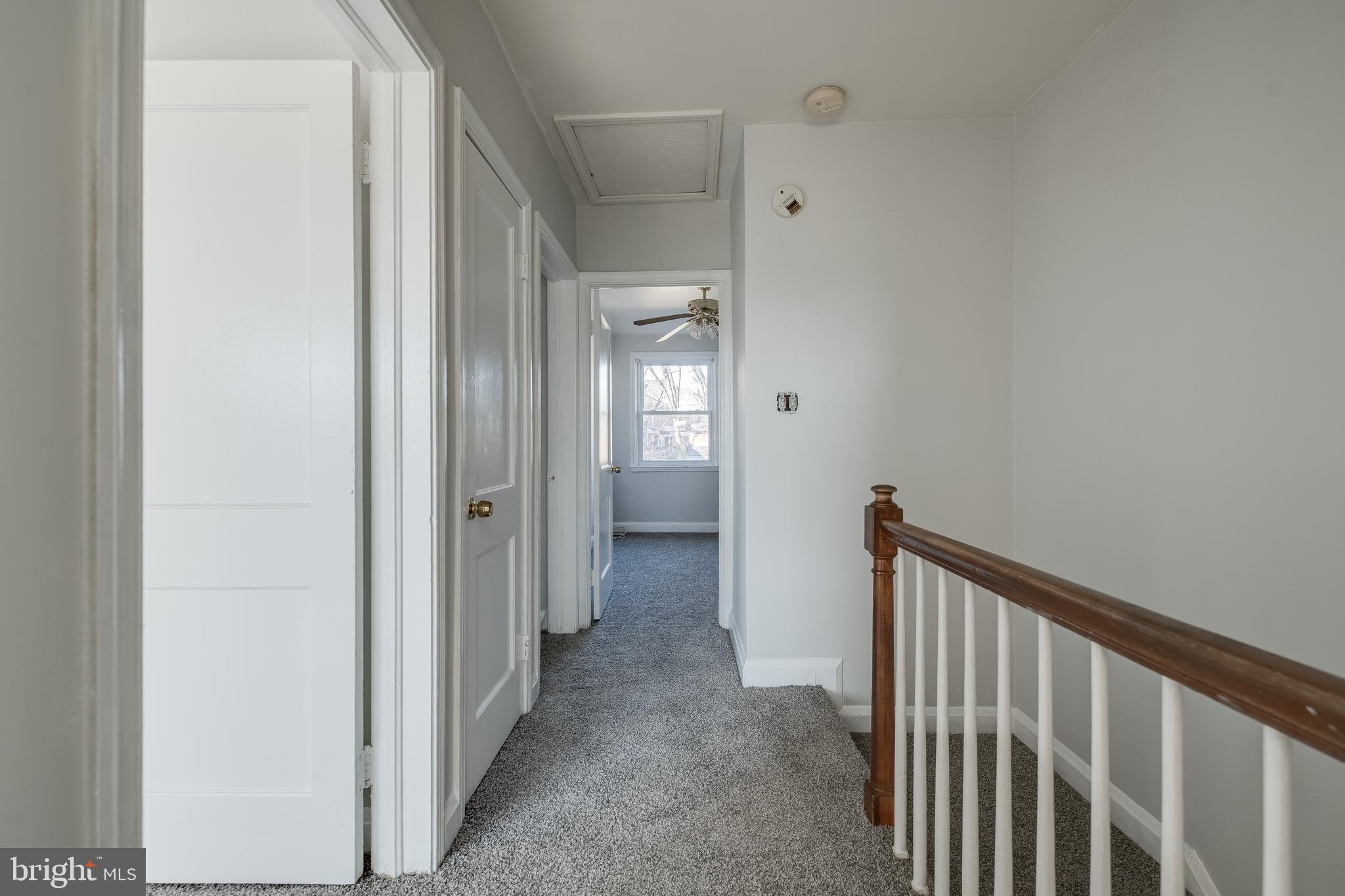 1306 East Cold Spring Lane Baltimore, MD 21239 - Photo 12 of 25 a view of a hallway with wooden floor and closet