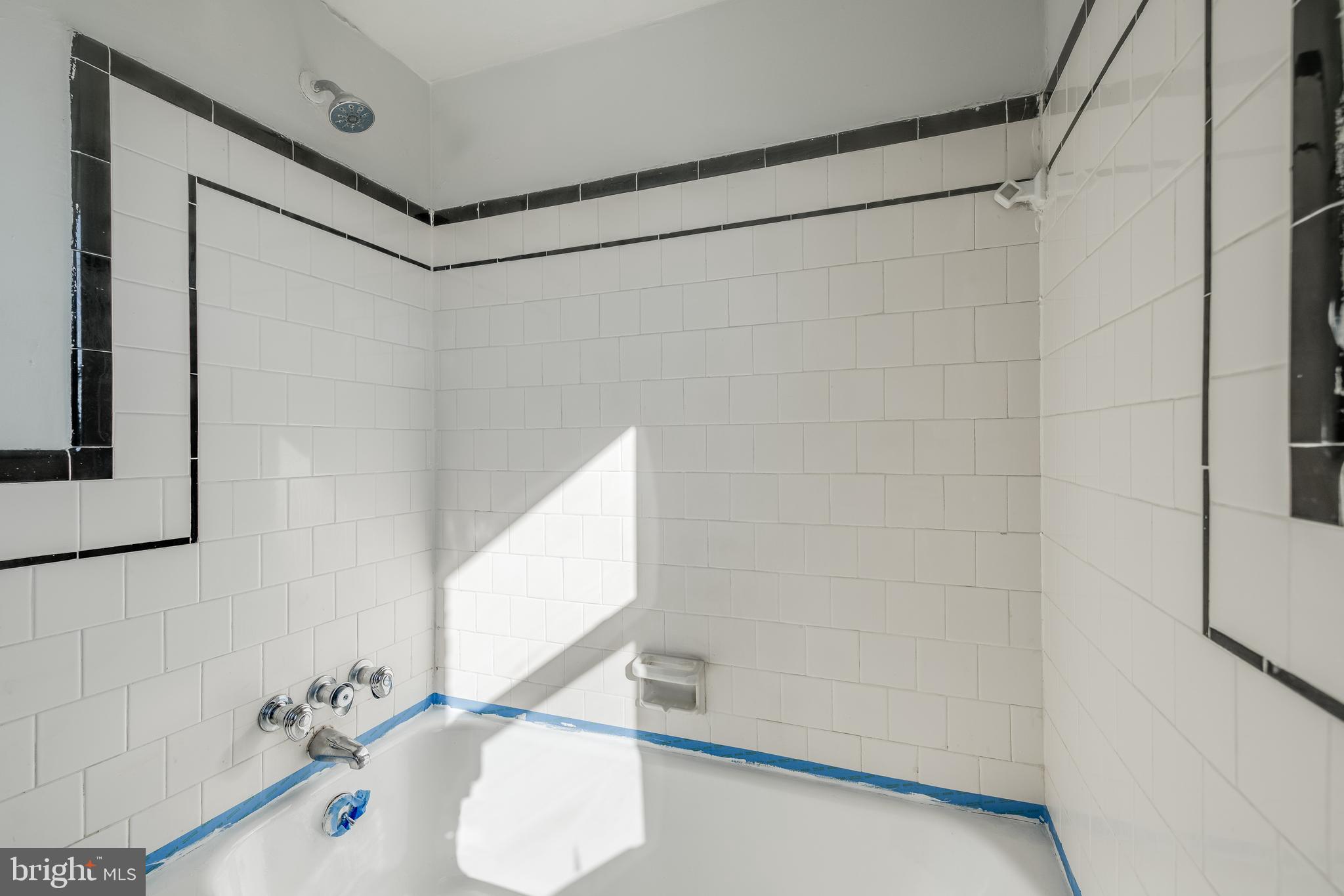 1306 East Cold Spring Lane Baltimore, MD 21239 - Photo 18 of 25 a bathroom with a shower and a sink