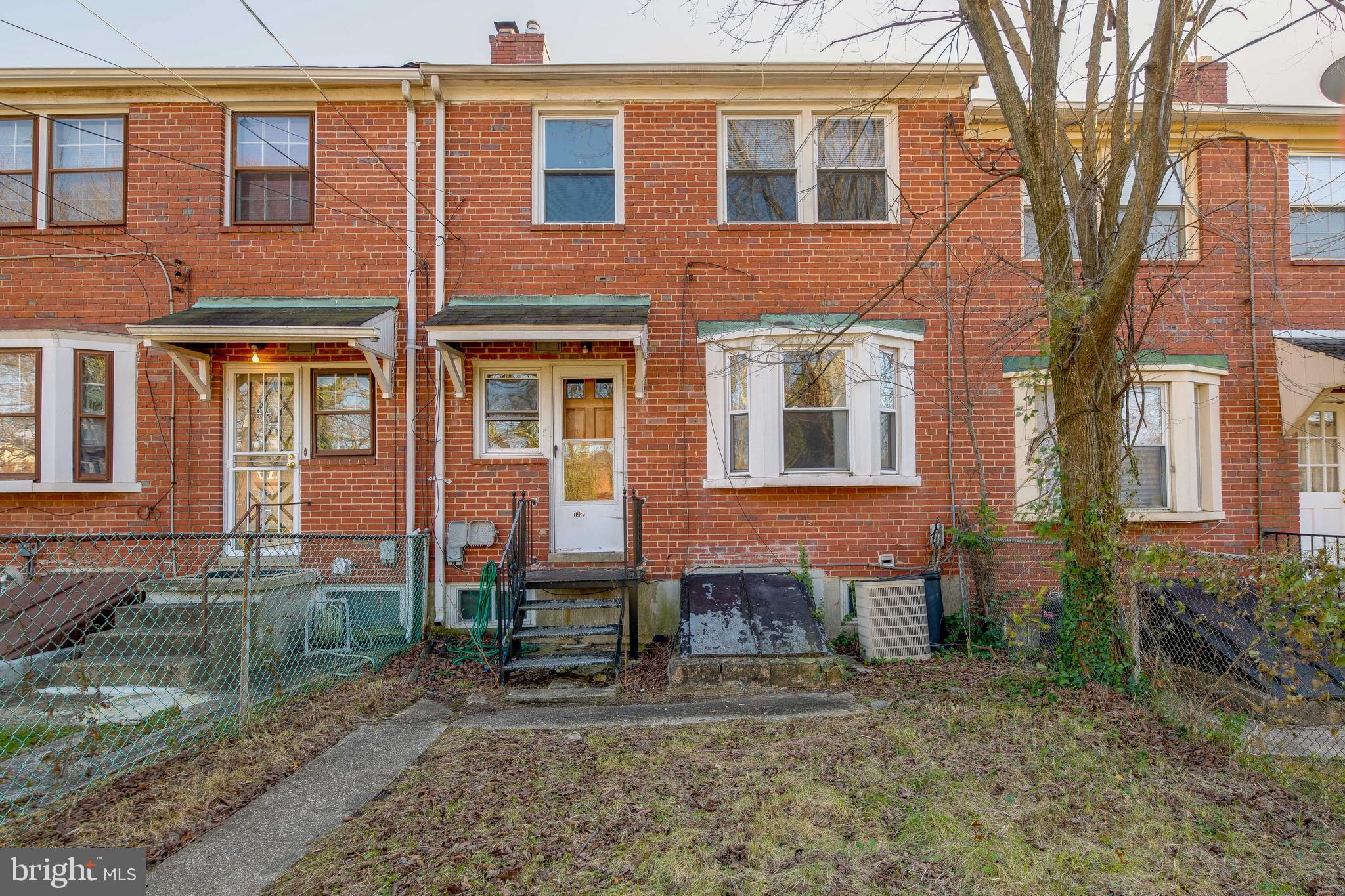 1306 East Cold Spring Lane Baltimore, MD 21239 - Photo 25 of 25 a brick building that has a lots of windows in it