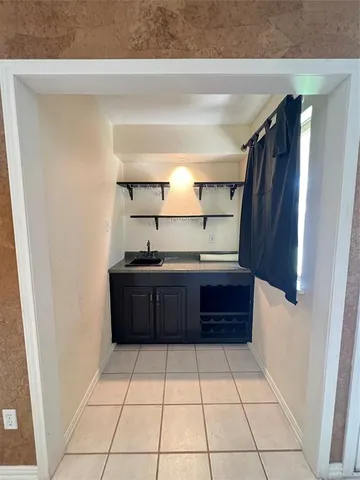 a bathroom with a sink vanity and mirror
