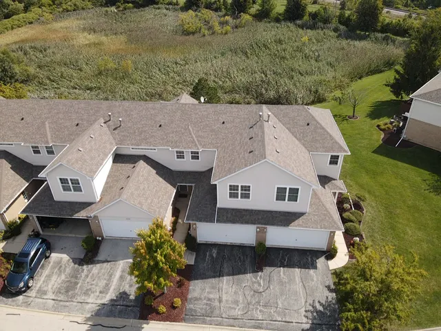 an aerial view of a house with a garden