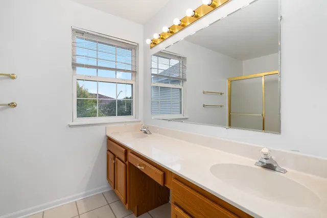 a bathroom with a sink and a window