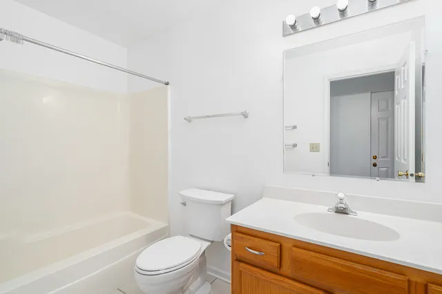 a bathroom with a sink a toilet and a bathtub