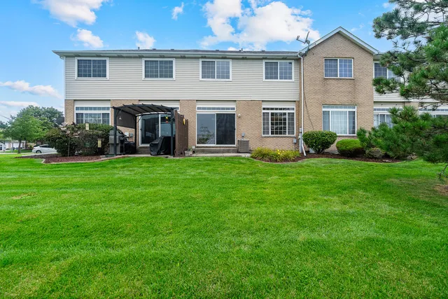 a front view of a house with garden and porch