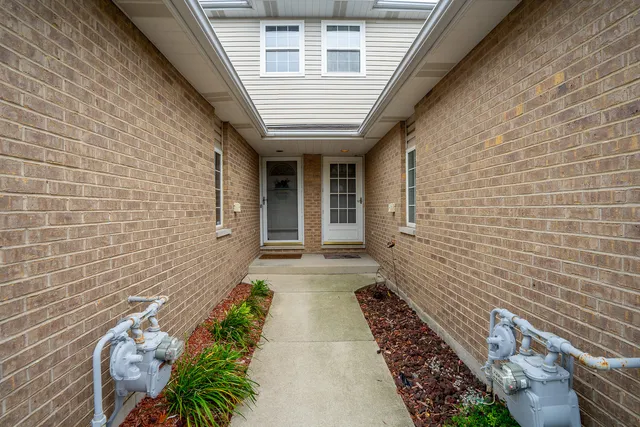 a view of a pathway with flower pots