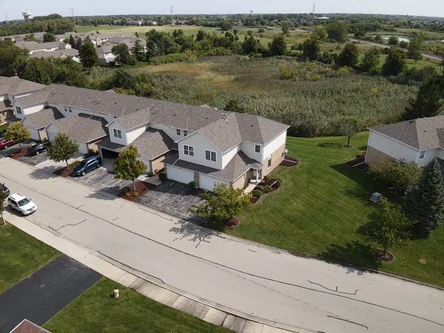 an aerial view of a house with outdoor space