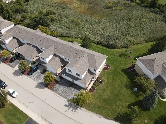 an aerial view of a house with a garden