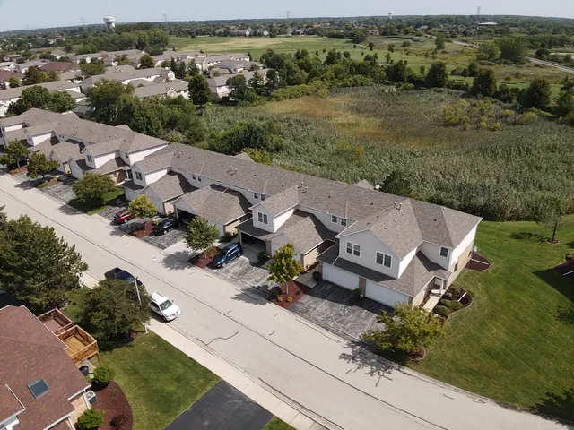 an aerial view of a house with mountain view