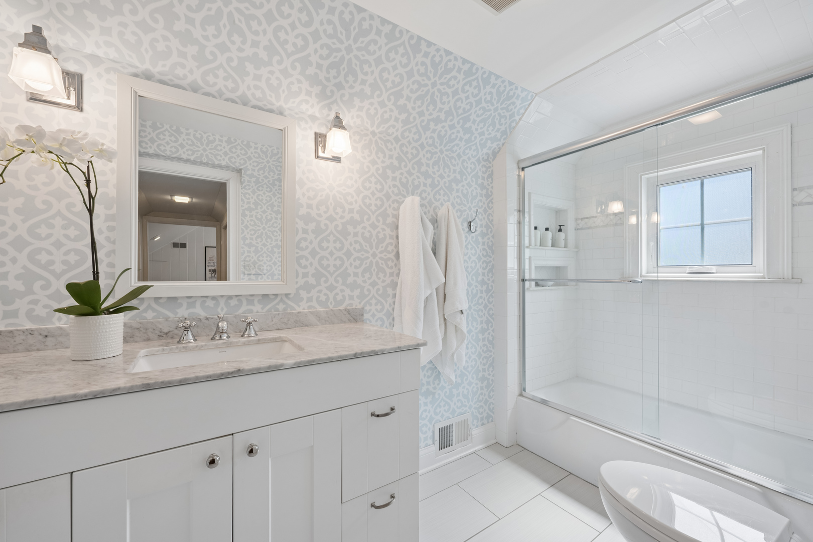 936 Sunset Road Winnetka, IL 60093 - Photo 32 of 50 a bathroom with a granite countertop sink a toilet and shower