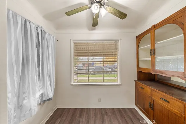 a view of a room with a window and wooden floor