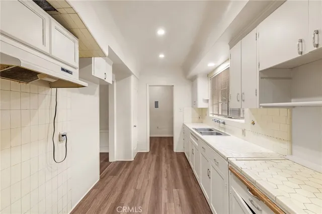 a bathroom with double vanity and a shower