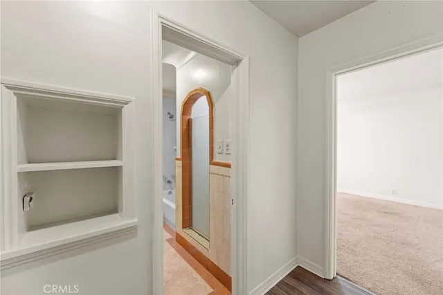 a view of a hallway with closet