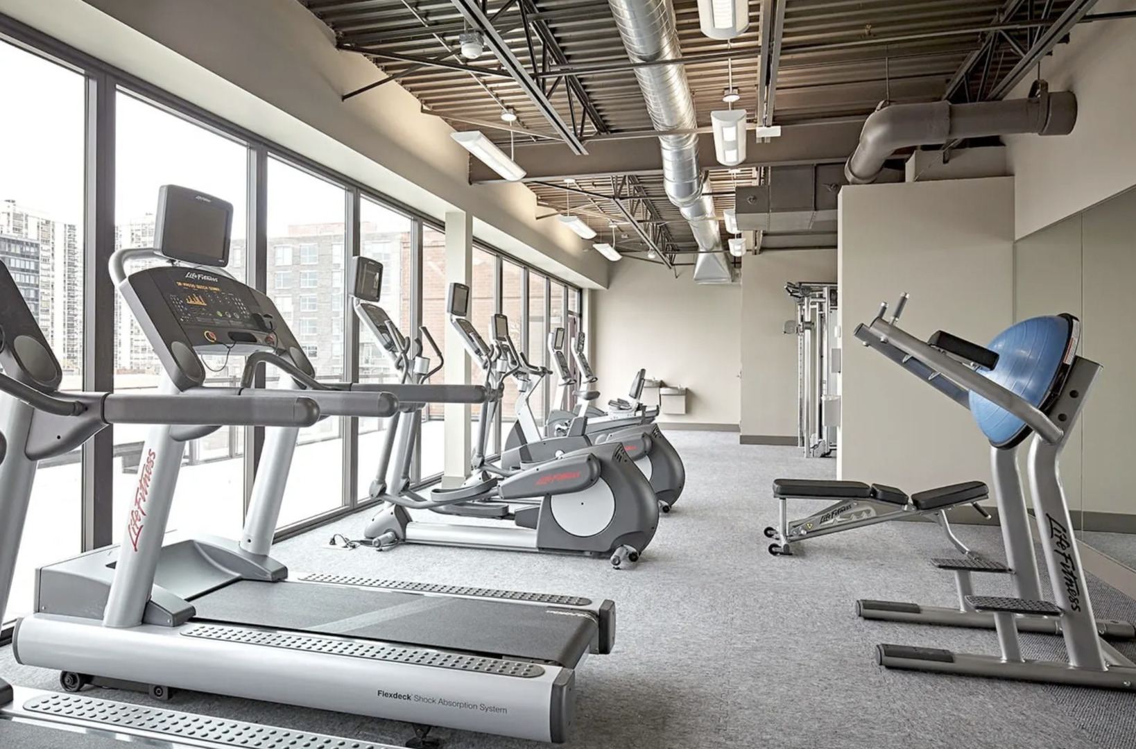 211 West Scott Street, Unit 408 Chicago, IL 60610 - Photo 7 of 8 a view of a room with gym equipment
