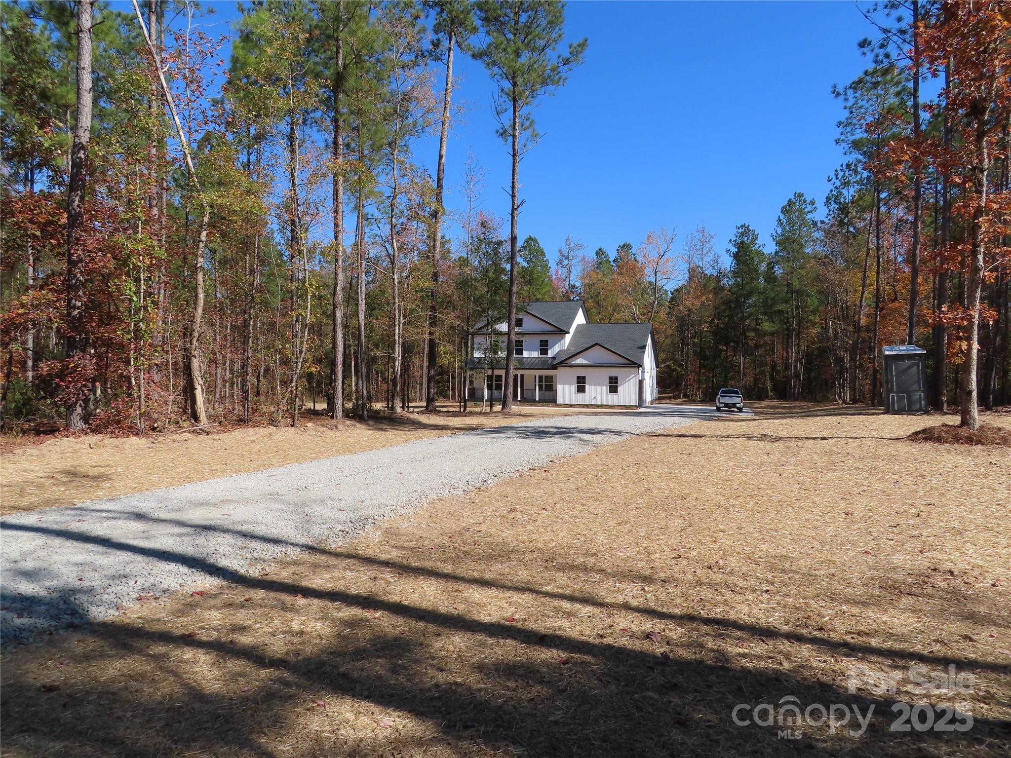 a house with trees in the background