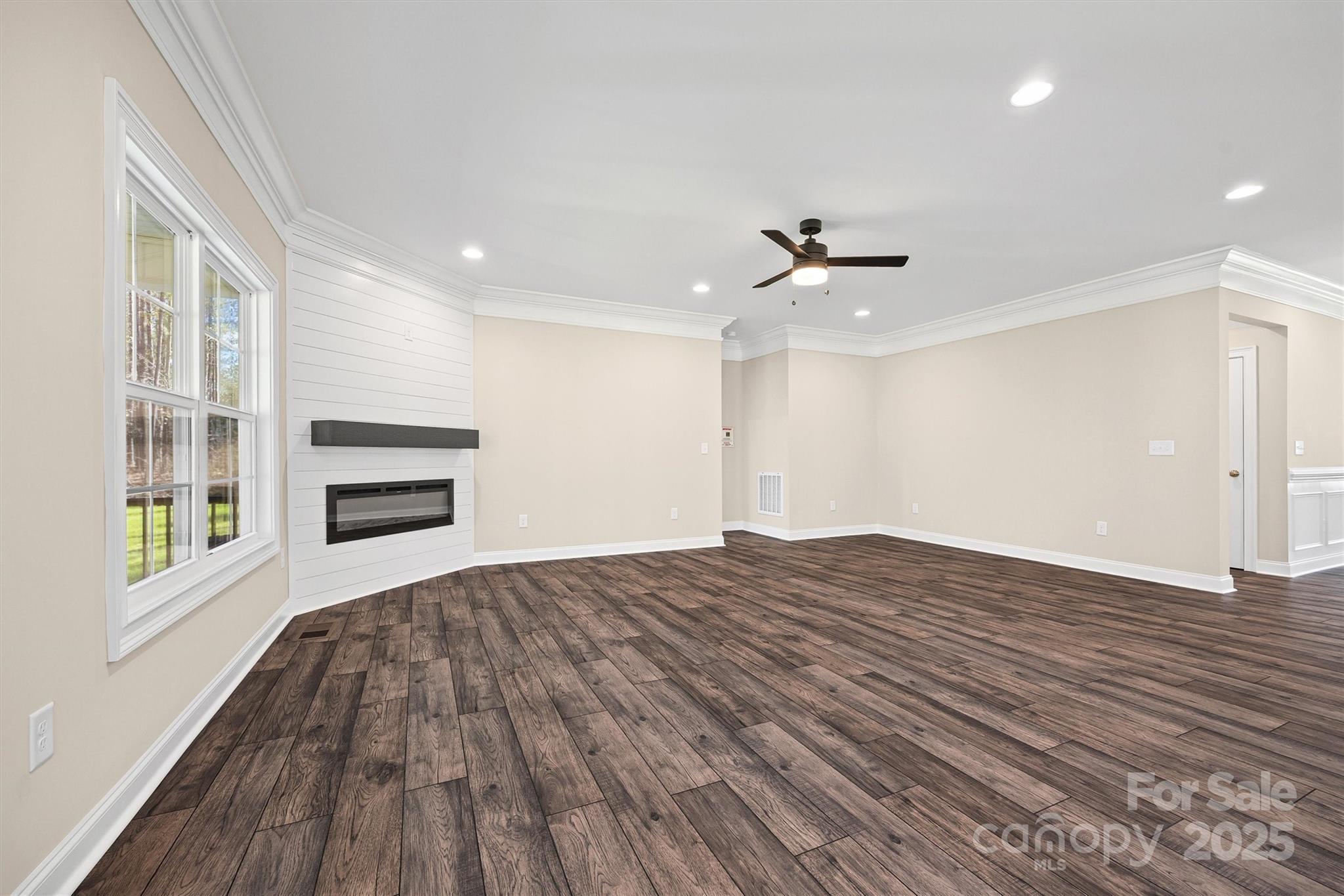 3812 Winter Road, Unit 5 Rock Hill, SC 29730 - Photo 19 of 37 a view of a livingroom with a fireplace a ceiling fan and wooden floor