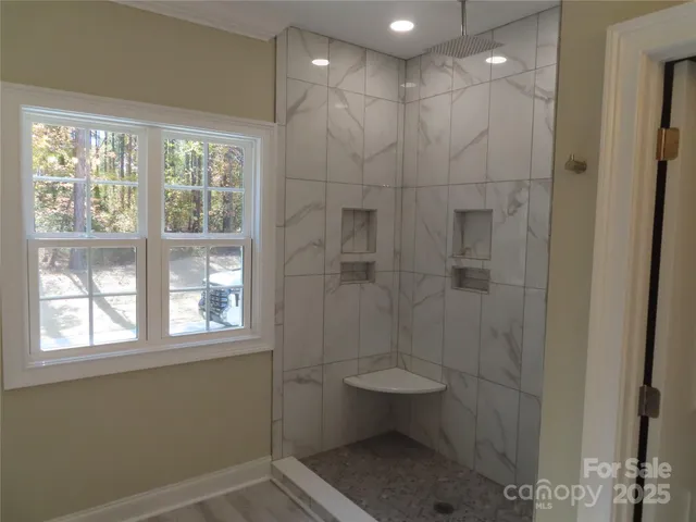 a white bath tub sitting in a bathroom